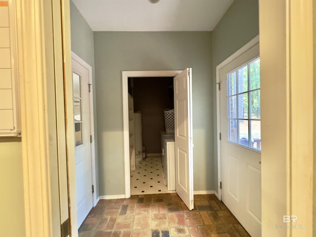 603 Northshore Dr, Bay Minette, AL 36507 - doorway to outside featuring brick patterned floors and baseboards