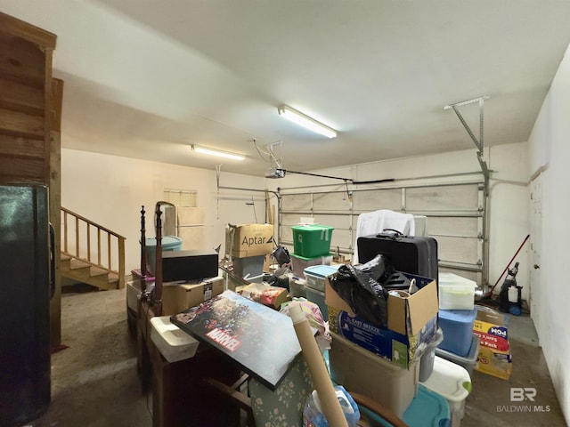 603 Northshore Dr, Bay Minette, AL 36507 - garage featuring freestanding refrigerator and a garage door opener
