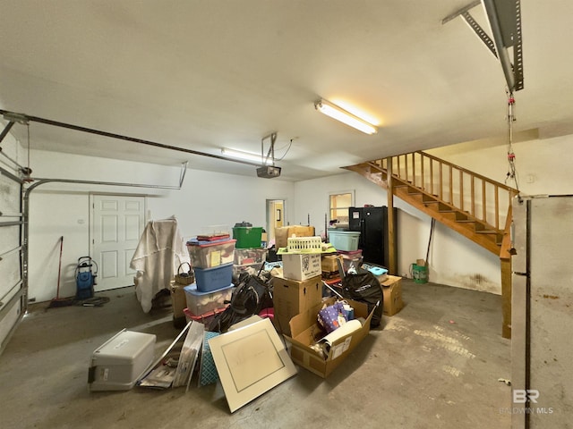 603 Northshore Dr, Bay Minette, AL 36507 - garage featuring a garage door opener and freestanding refrigerator