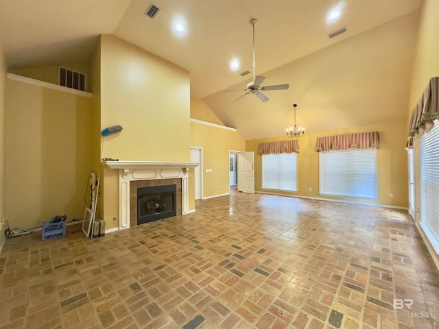 603 Northshore Dr, Bay Minette, AL 36507 - unfurnished living room featuring a ceiling fan, high vaulted ceiling, a fireplace, brick floors, and baseboards