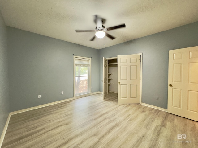 603 Northshore Dr, Bay Minette, AL 36507 - unfurnished bedroom featuring light wood-style flooring, baseboards, a closet, and ceiling fan