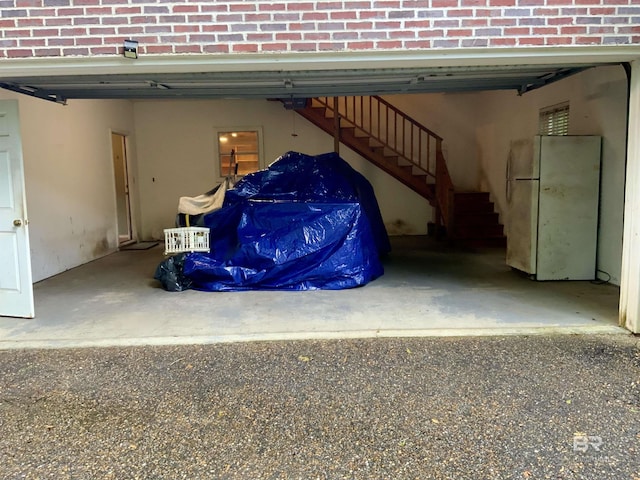 603 Northshore Dr, Bay Minette, AL 36507 - garage featuring freestanding refrigerator
