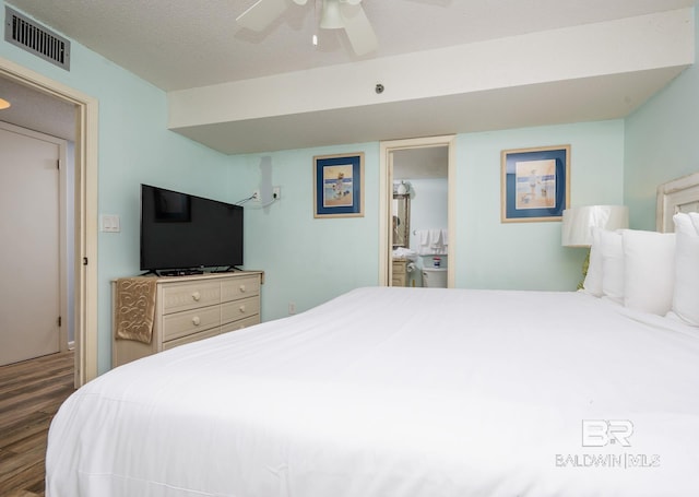 24132 Perdido Beach Blvd Unit 1024, Orange Beach, AL 36561 - bedroom with visible vents, a textured ceiling, wood finished floors, and a ceiling fan