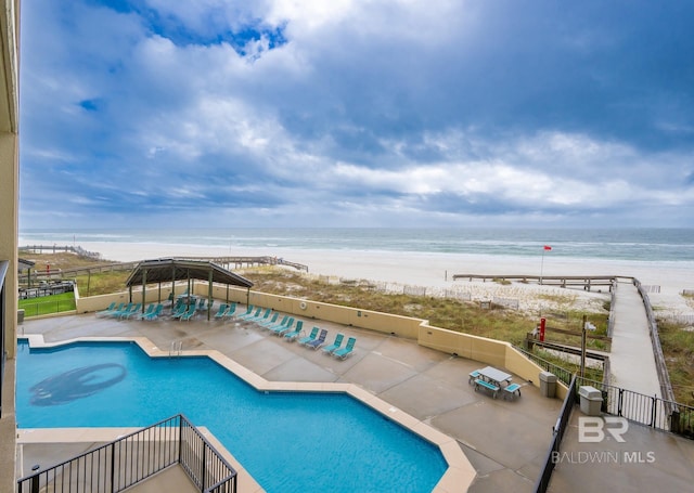 24132 Perdido Beach Blvd Unit 1024, Orange Beach, AL 36561 - community pool with a patio area, a water view, fence, and a view of the beach
