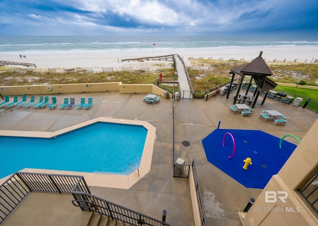 24132 Perdido Beach Blvd Unit 1024, Orange Beach, AL 36561 - view of pool featuring a patio, a beach view, and a water view