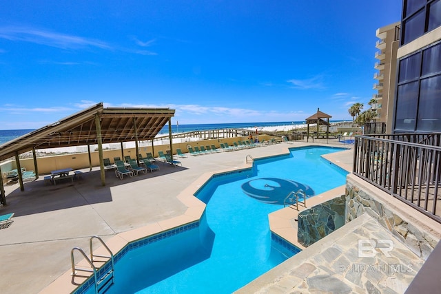 24132 Perdido Beach Blvd Unit 1024, Orange Beach, AL 36561 - community pool with a gazebo, a patio, and a water view
