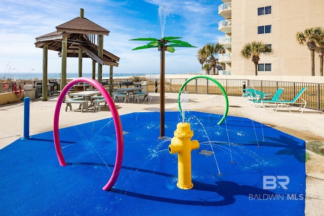 24132 Perdido Beach Blvd Unit 1024, Orange Beach, AL 36561 - view of play area featuring a patio and fence