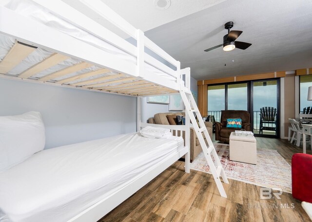 24132 Perdido Beach Blvd Unit 1024, Orange Beach, AL 36561 - bedroom featuring access to outside and wood finished floors