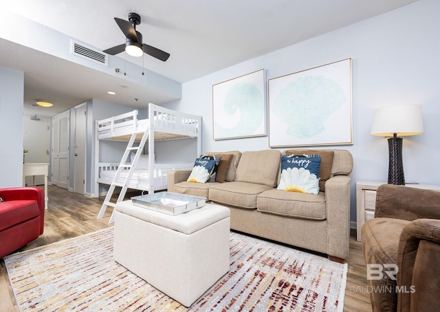 24132 Perdido Beach Blvd Unit 1024, Orange Beach, AL 36561 - living area featuring visible vents, a ceiling fan, and wood finished floors
