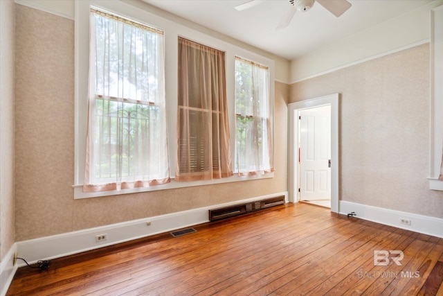 unfurnished room featuring ceiling fan and hardwood / wood-style flooring