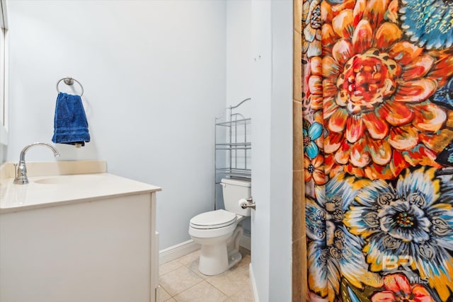 bathroom featuring tile patterned floors, toilet, and vanity