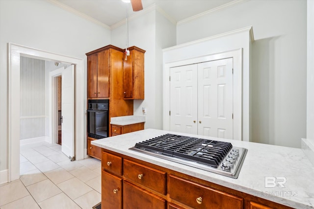 kitchen featuring black oven, light tile patterned floors, crown molding, stainless steel gas cooktop, and ceiling fan