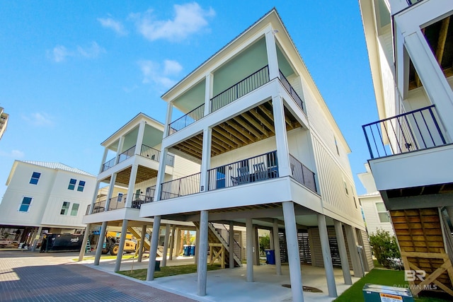 view of property with stairway and a carport