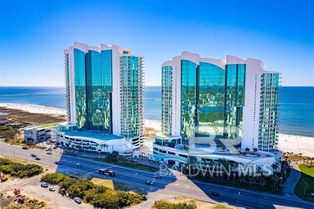 exterior space with a water view and a view of the beach