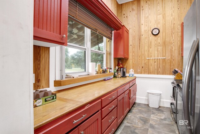 bathroom with wood walls