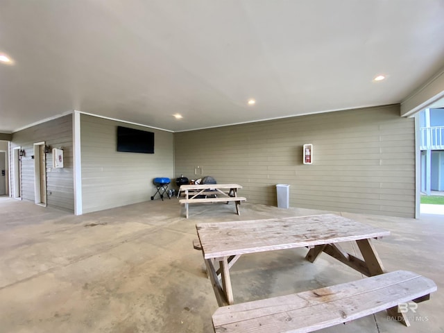 exterior space featuring concrete floors and recessed lighting