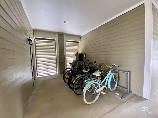 garage featuring wood walls