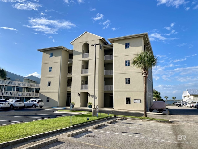 view of property with uncovered parking