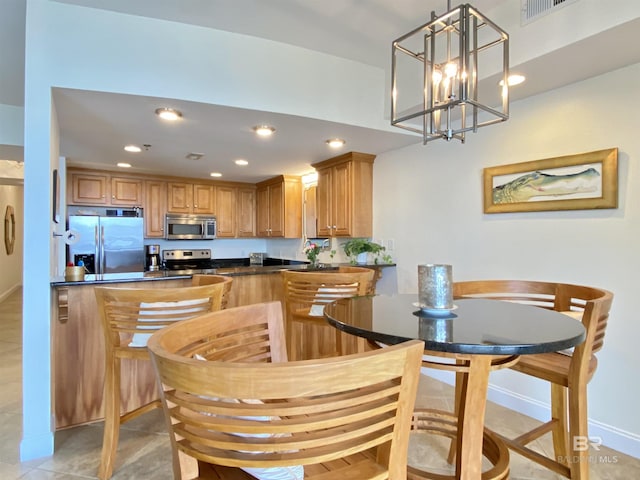 dining space with baseboards, visible vents, and recessed lighting