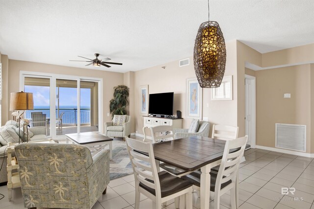 13601 Perdido Key Dr Unit W-12A, Perdido Key, FL 32507 - dining room with visible vents, a textured ceiling, ceiling fan, and light tile patterned flooring