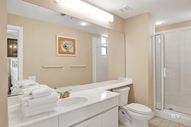 13601 Perdido Key Dr Unit W-12A, Perdido Key, FL 32507 - bathroom featuring tile patterned floors, a stall shower, vanity, toilet, and visible vents