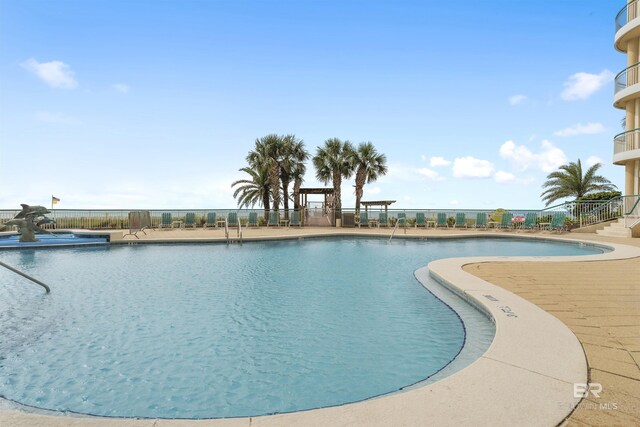 13601 Perdido Key Dr Unit W-12A, Perdido Key, FL 32507 - community pool featuring a patio area and fence