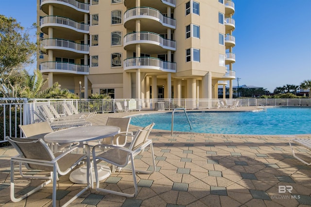 13601 Perdido Key Dr Unit W-12A, Perdido Key, FL 32507 - pool with fence and a patio area
