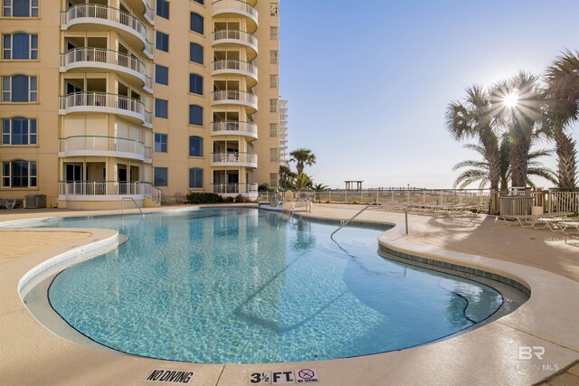 13601 Perdido Key Dr Unit W-12A, Perdido Key, FL 32507 - community pool featuring central AC, fence, and a patio