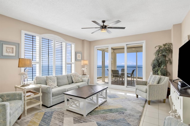 13601 Perdido Key Dr Unit W-12A, Perdido Key, FL 32507 - living room with a wealth of natural light, a ceiling fan, and a textured ceiling