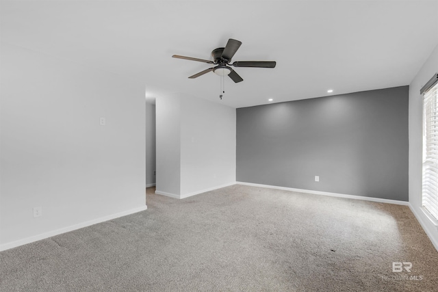 carpeted empty room with ceiling fan