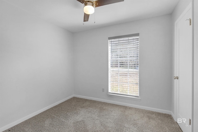 empty room featuring ceiling fan and carpet flooring