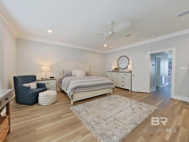 bedroom featuring ceiling fan, ornamental molding, and light wood-type flooring