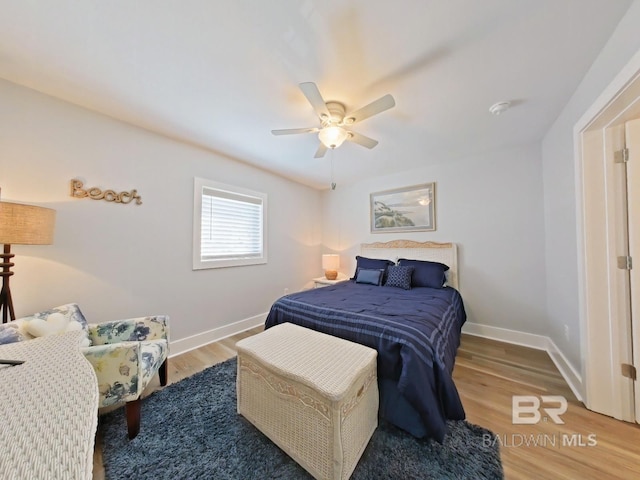 bedroom featuring hardwood / wood-style flooring and ceiling fan