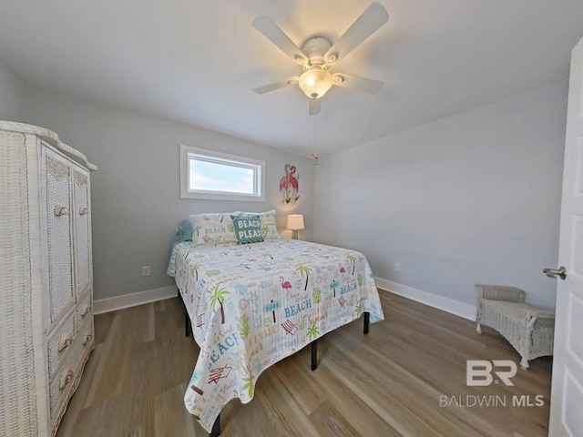 bedroom featuring hardwood / wood-style floors and ceiling fan