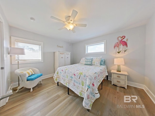 bedroom featuring hardwood / wood-style flooring and ceiling fan