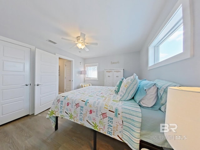 bedroom with hardwood / wood-style floors and ceiling fan