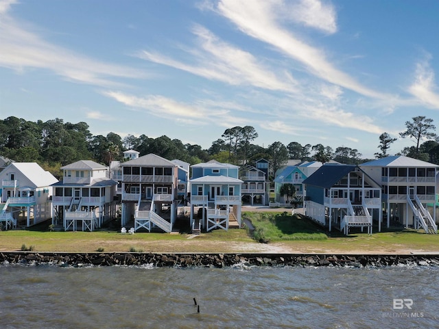 rear view of house with a water view