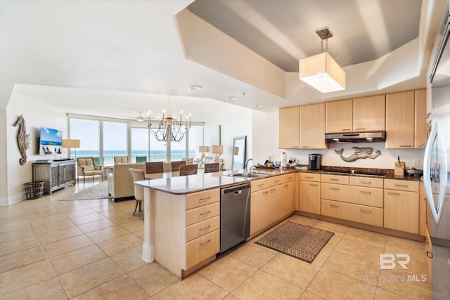 kitchen with pendant lighting, kitchen peninsula, light brown cabinetry, and stainless steel dishwasher