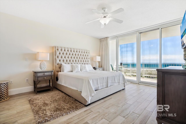 bedroom with light hardwood / wood-style flooring, access to exterior, and ceiling fan