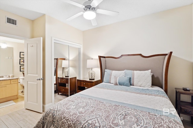 bedroom featuring a closet, light wood-type flooring, and ceiling fan