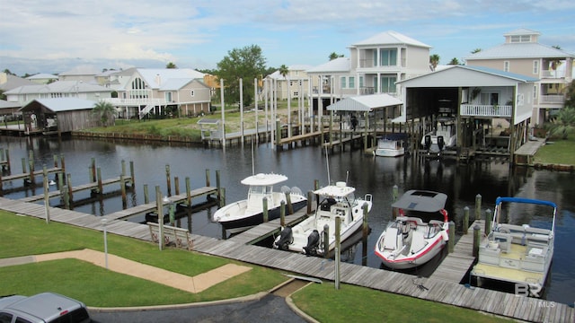 view of dock featuring a water view and a lawn