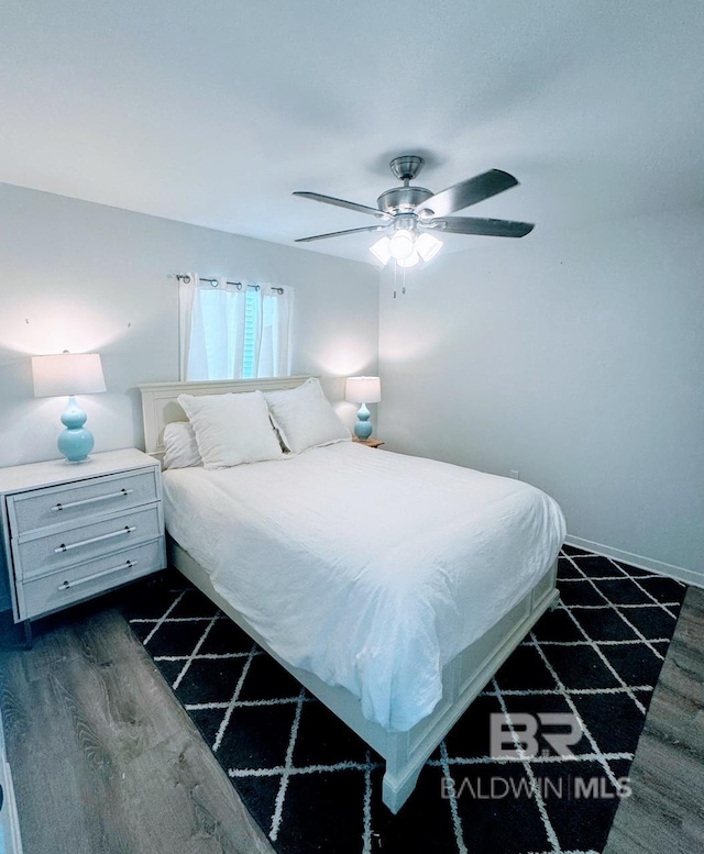 bedroom featuring hardwood / wood-style floors and ceiling fan