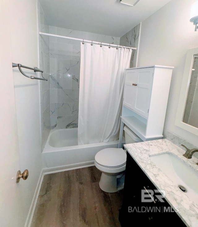 full bathroom with vanity, toilet, wood-type flooring, and shower / bath combo with shower curtain