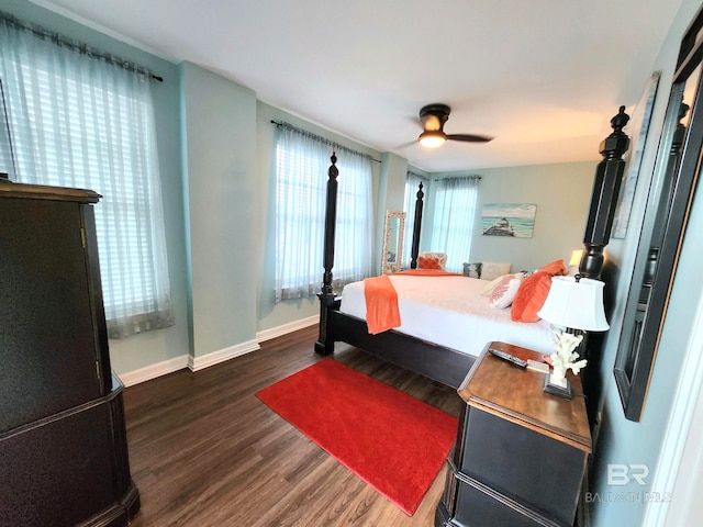 bedroom featuring dark hardwood / wood-style flooring and ceiling fan