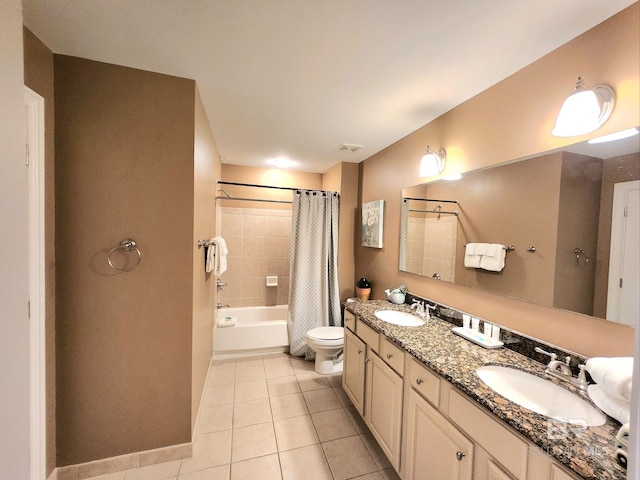 full bathroom with tile patterned flooring, vanity, toilet, and shower / bath combo with shower curtain