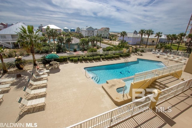 view of swimming pool featuring a patio area