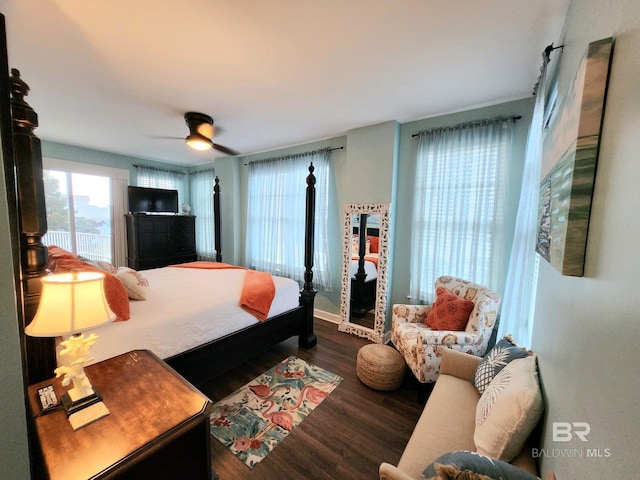 bedroom featuring ceiling fan and dark hardwood / wood-style flooring