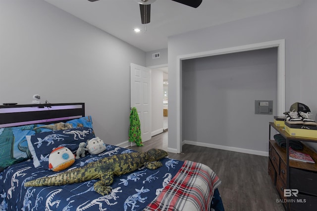 bedroom with ceiling fan and dark wood-type flooring