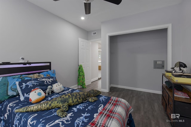 bedroom featuring wood finished floors, visible vents, baseboards, and ceiling fan