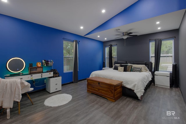 bedroom with vaulted ceiling, ceiling fan, and hardwood / wood-style floors